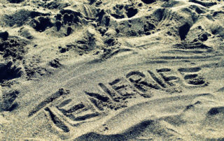Tenerife written in the sand of the beach